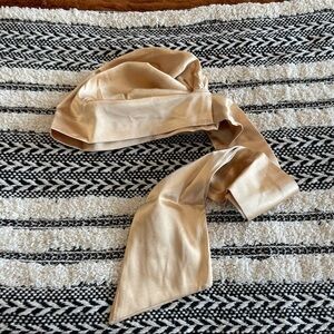 New in package gold colored satin surturban one size